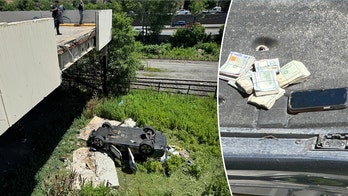 Porsche mysteriously flies off NYC parking garage, police find pile of cash on top of wreck but no driver