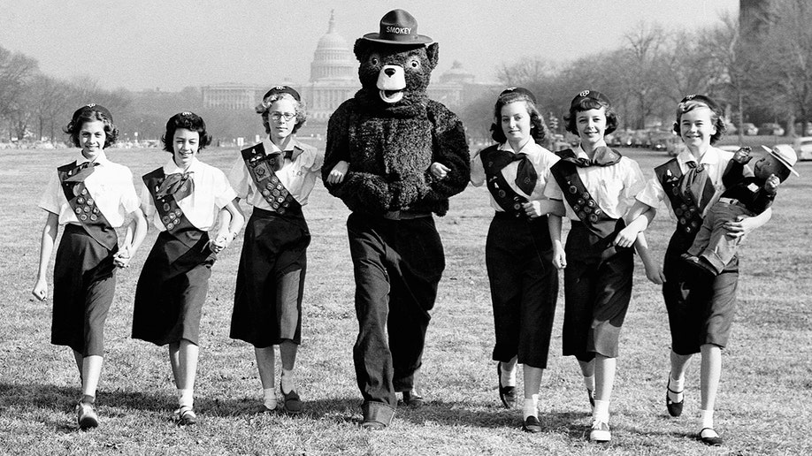 Smokey Bear with Girl Scouts from Maryland in front of the Capitol.