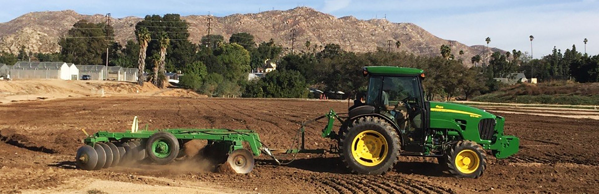 Green tractor on field