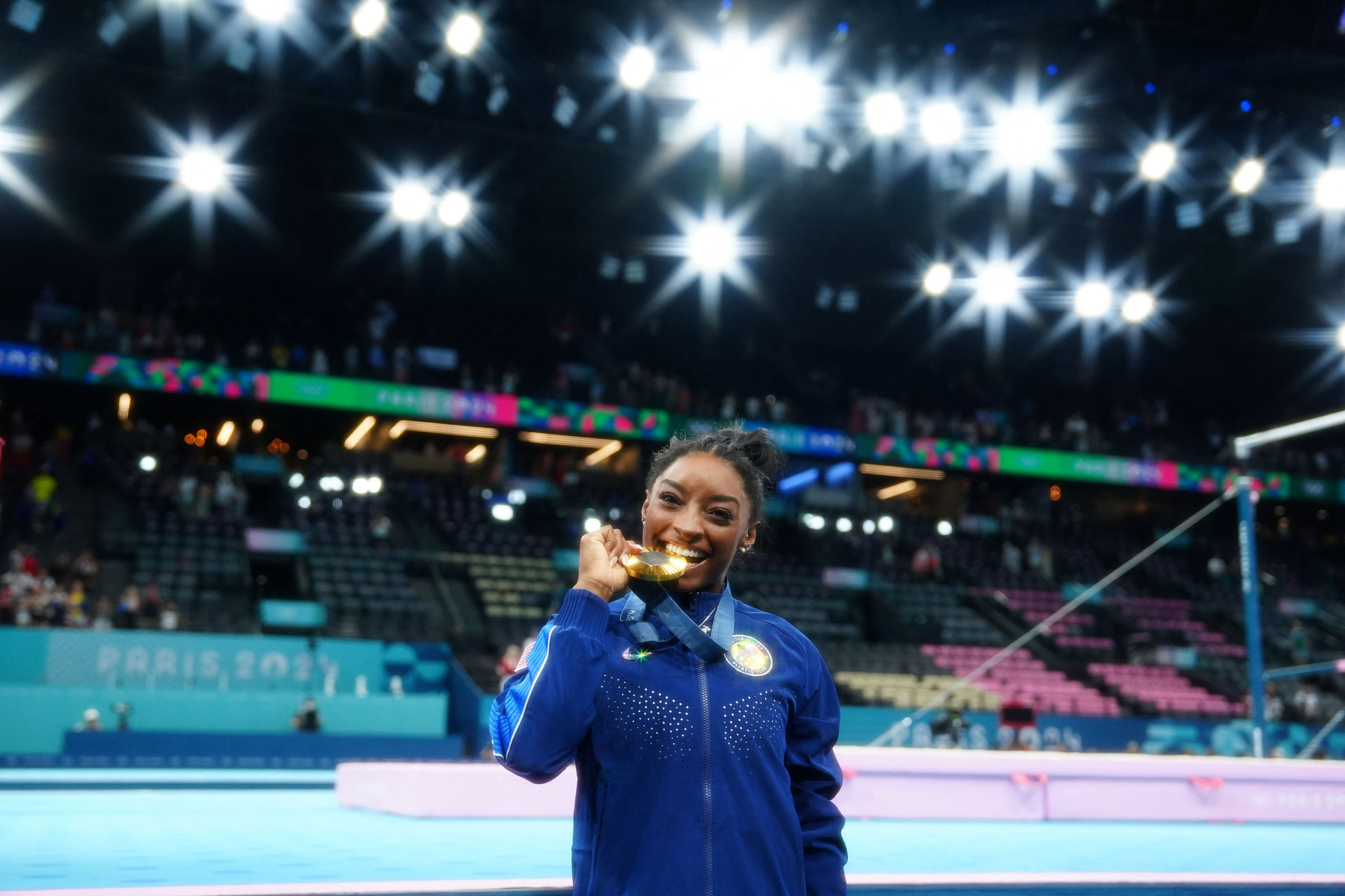 Gold medalist Simone Biles of United States celebrates after winning the women’s gymnastics all-around final.