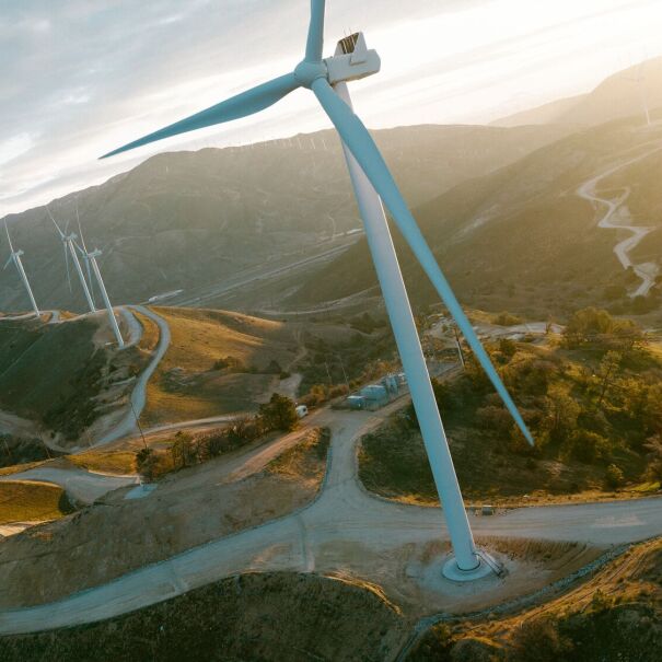 Renewable energy landscape with wind turbines and river