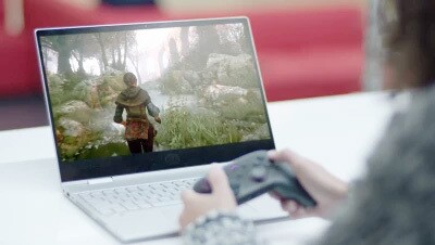 A close up image of a child playing a video game with Amazon Luna. 