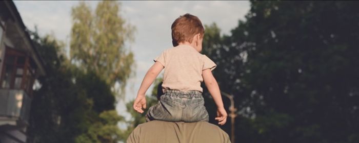 Child on father's shoulder