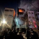 Firefighters battle an early-morning East Boston fire.