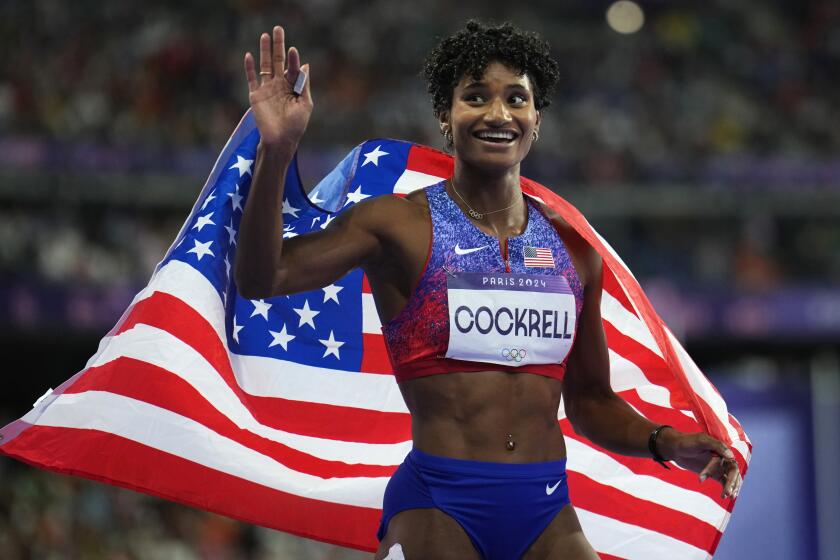 Anna Cockrell, of the United States, celebrates after her second place finish in the women's heptathlon 200-meters at the 2024 Summer Olympics, Thursday, Aug. 8, 2024, in Saint-Denis, France. (AP Photo/Petr David Josek)