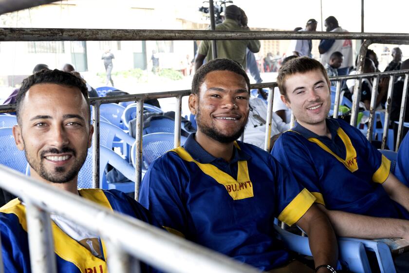 CORRECTS ID: Benjamin Reuben Zalman-Polun, left, Marcel Malanga and Tyler Thompson, all American citizens, attend a court verdict in Congo, Kinshasa, Friday, Sept. 13, 2024, on charges of taking part in a coup attempt in May 2024. (AP Photo/Samy Ntumba Shambuyi)