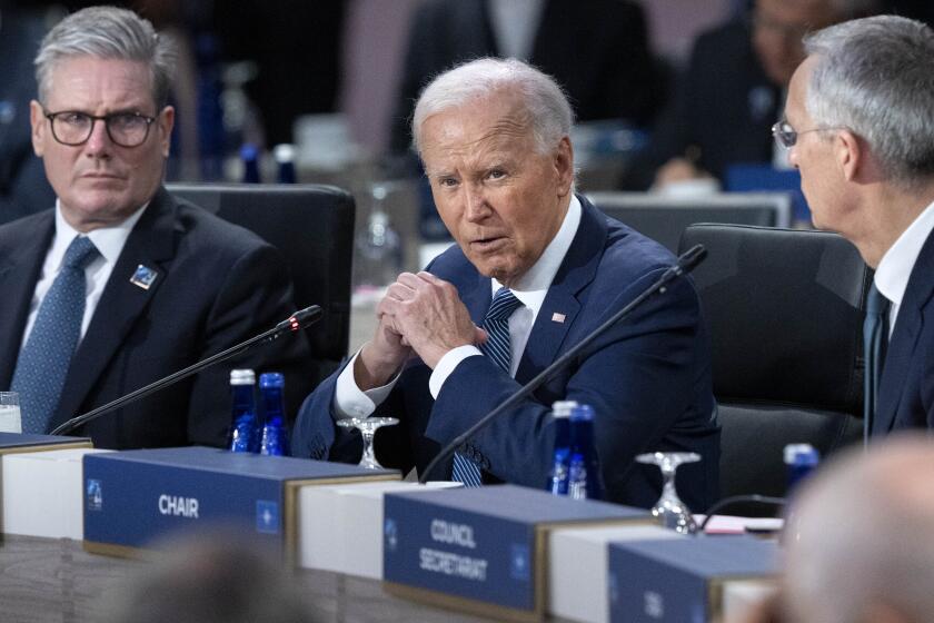 President Joe Biden makes opening remarks during the NATO summit in Washington, Wednesday July 10, 2024, next to NATO Attorney General Jens Stoltenberg, right, and British Prime Minister Keir Starmer, left. (AP Photo/Jacquelyn Martin)