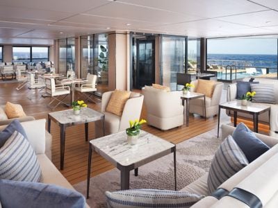 A lounge aboard a yacht that opens to the outdoors