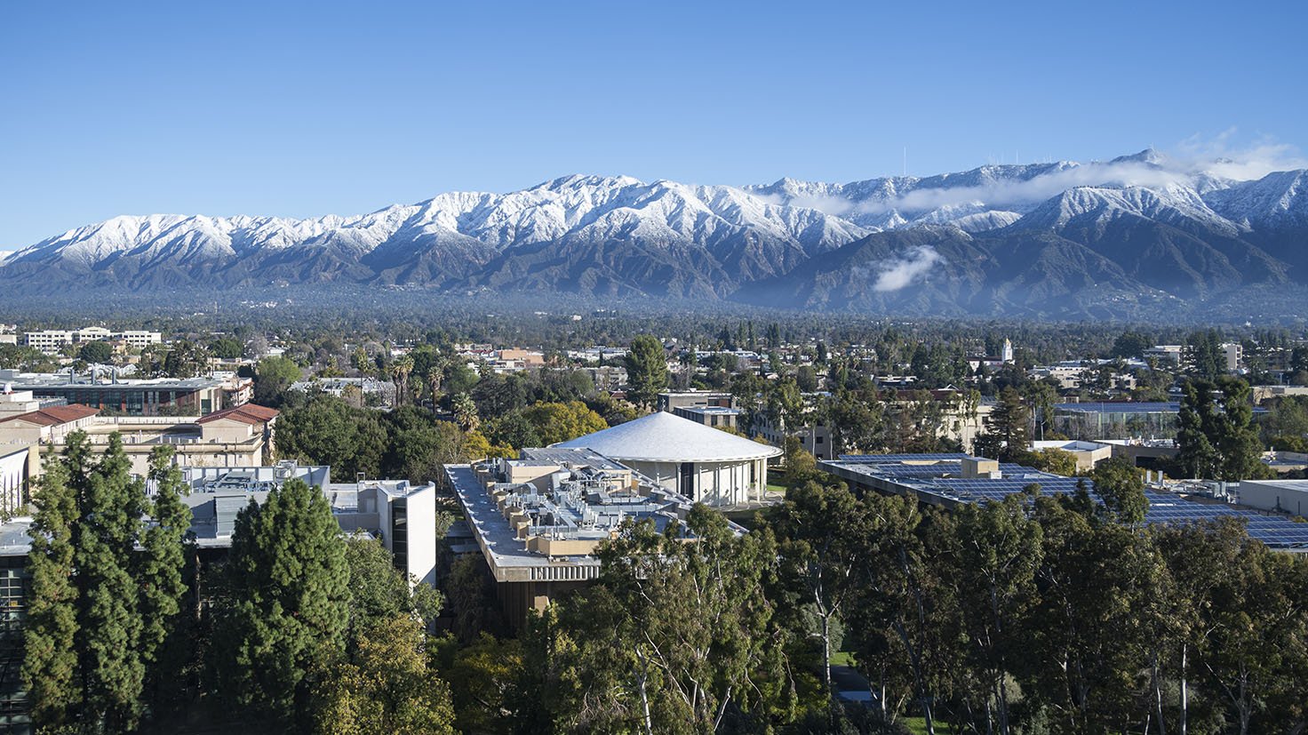 An aerial photo of campus with San Gabriel mountains in the background