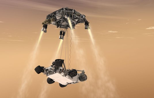 An artist's concept of how NASA's Curiosity Mars rover was lowered to the planet's surface using the sky crane maneuver.