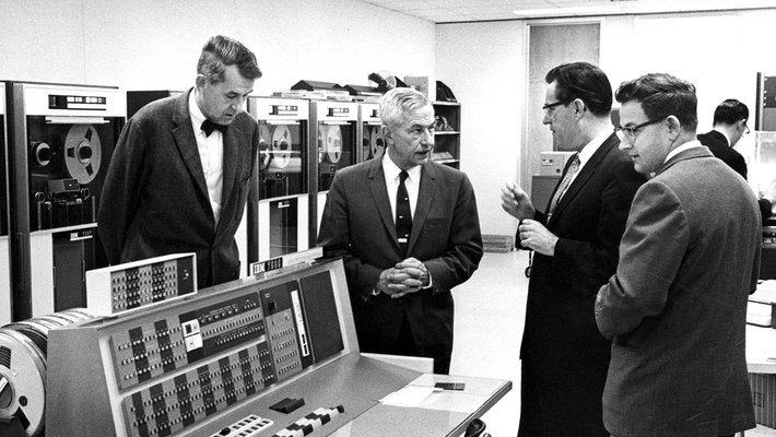 Frederick Lindvall, Lee DuBridge, Gilbert McCann, and Kendrick Hebert in the Willis H. Booth Computing Center