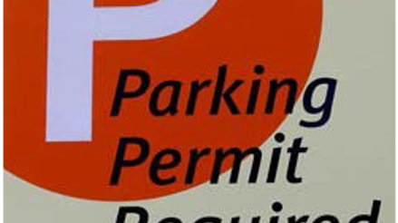 Tan sign with large red circle with a large white P. Sign reads "Parking Permit Required" and "Violators may be cited or towed at vehicle owner's expense. (VC 22658, VC 21113A, CVC 22651)." The telephone number for Caltech Security is provided, 626-395-4701.