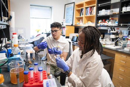 WAVE graduate students Christian Dimayuga and Judah Bates doing research in the lab.