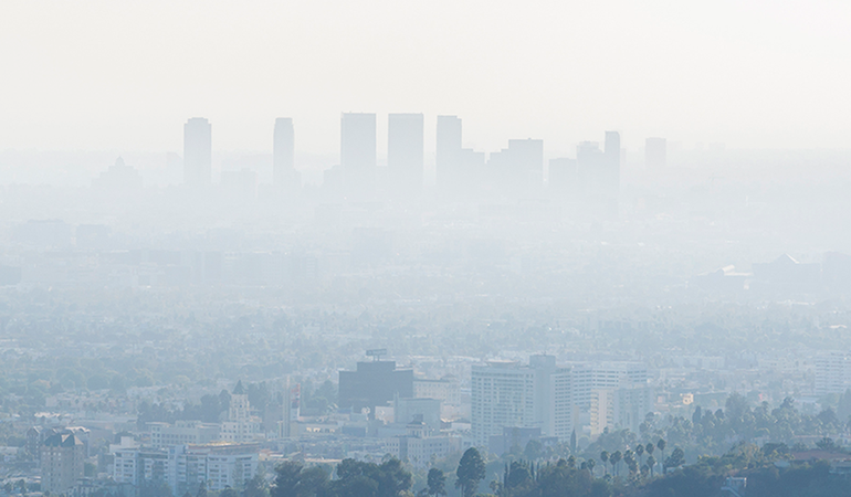 Automobile exhaust and smog covering the city of Los Angeles.