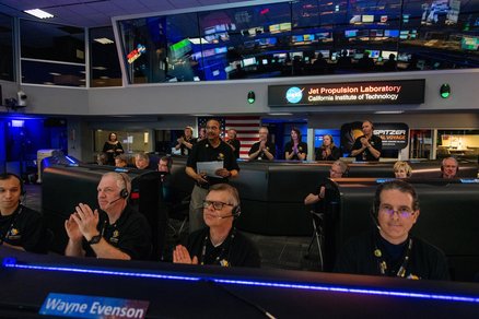 JPL staff applauding inside Mission Control.