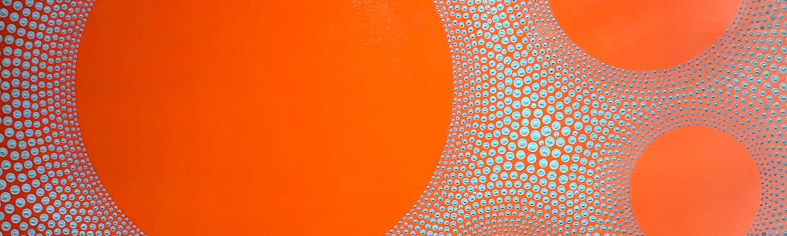 Picture of a painting of orange circles on a background of tiny orange circle outlines