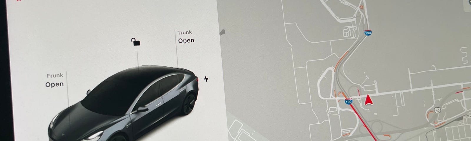 A photo of the center display in a Telsa Model 3 with the author’s prototype displayed