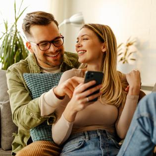 Woman and man looking at phone