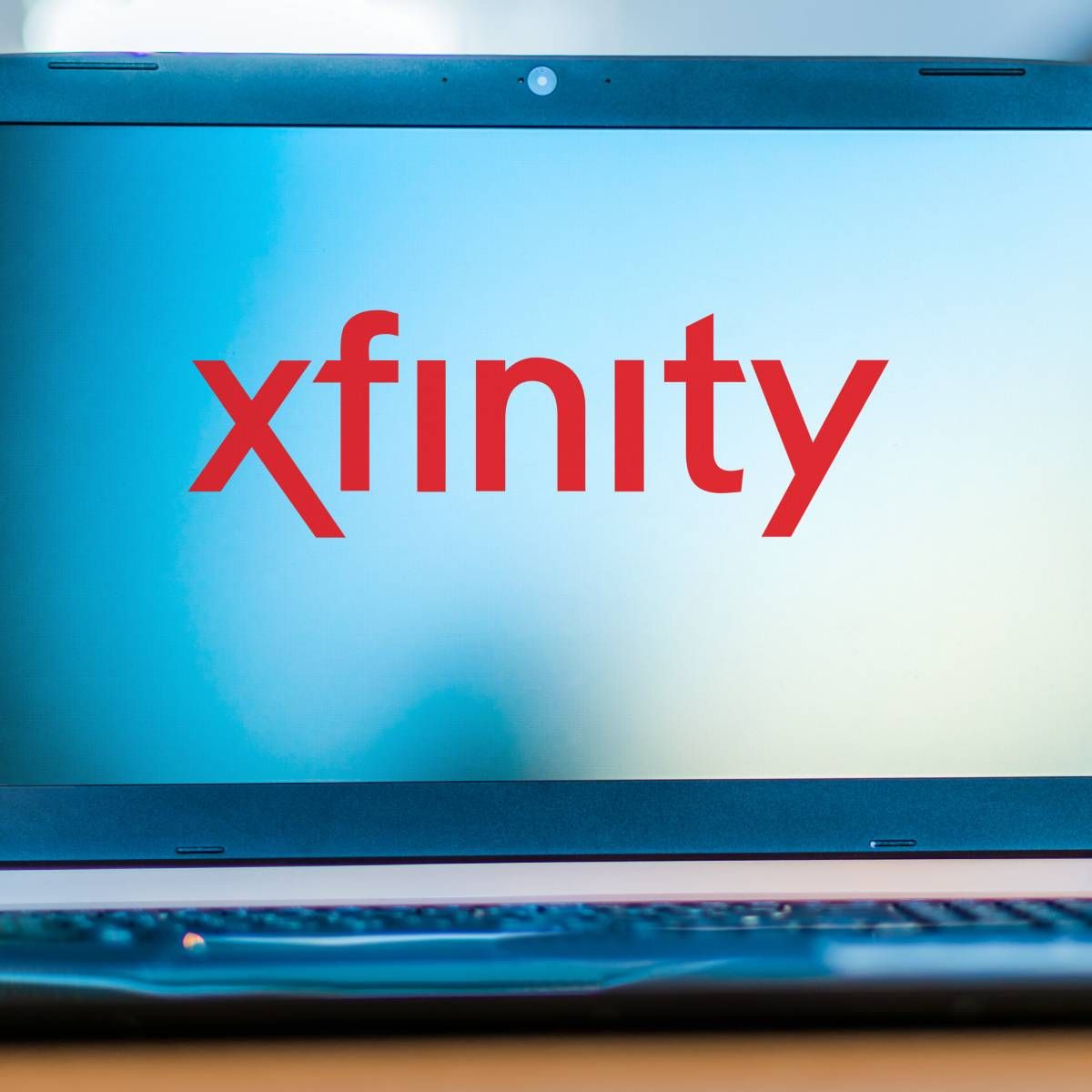 A laptop displaying the Xfinity logo.