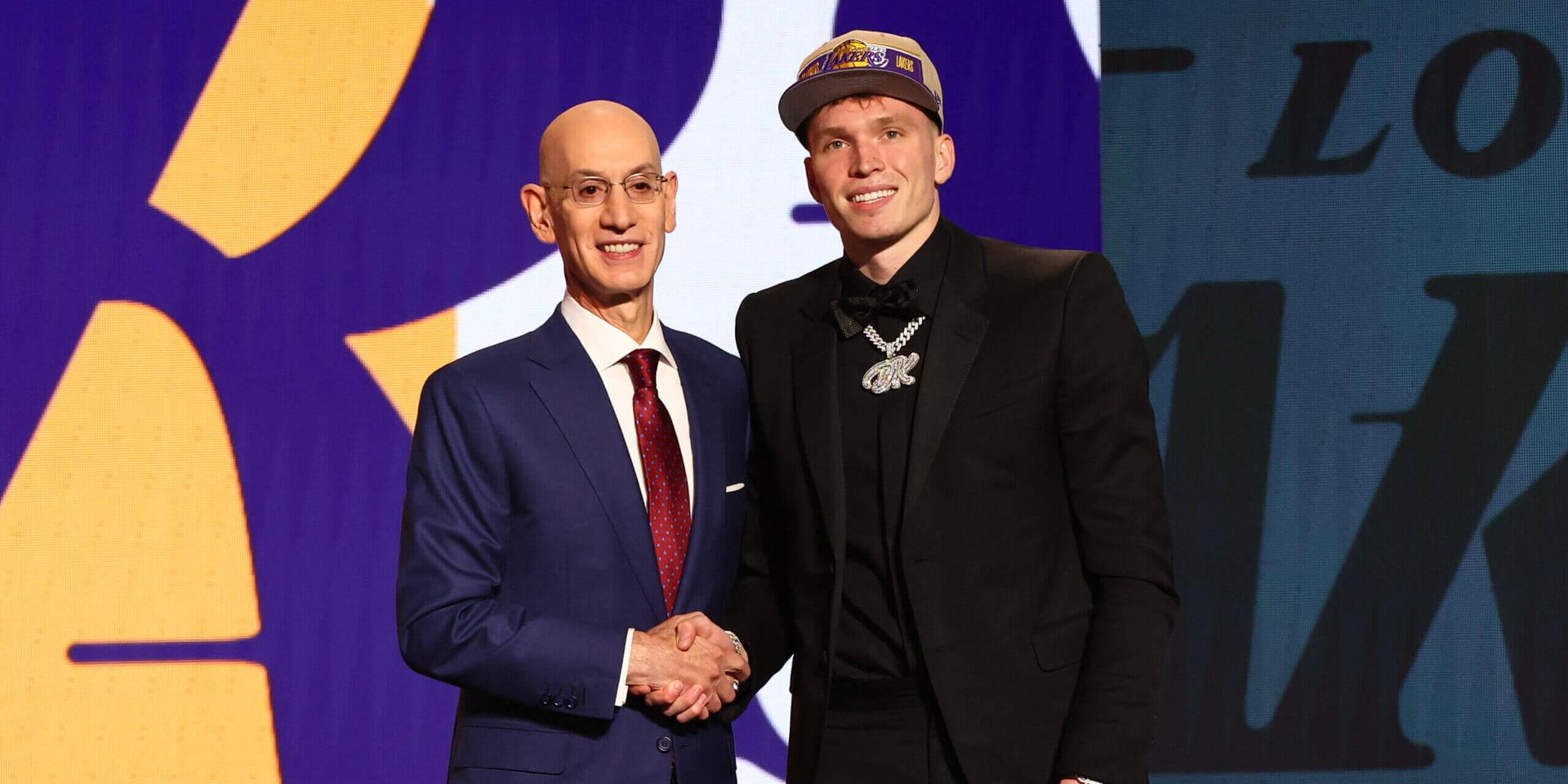 NEW YORK, NEW YORK - JUNE 26: Dalton Knecht (R) shakes hands with NBA commissioner Adam Silver (L) after being drafted 17th overall by the Los Angeles Lakers during the first round of the 2024 NBA Draft at Barclays Center on June 26, 2024 in the Brooklyn borough of New York City. NOTE TO USER: User expressly acknowledges and agrees that, by downloading and or using this photograph, User is consenting to the terms and conditions of the Getty Images License Agreement. (Photo by Sarah Stier/Getty Images)