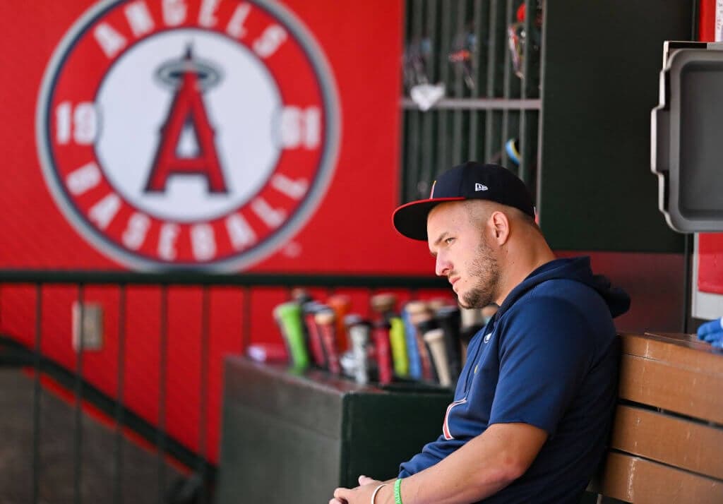 ANAHEIM, CALIFORNIA - JULY 28: Mike Trout #27 of the Los Angeles Angels looks on in the dugout during the regular season game against the Oakland Athletics at Angel Stadium of Anaheim on July 28, 2024 in Anaheim, California. (Photo by Gene Wang/Getty Images)