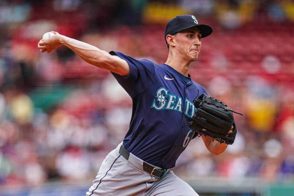 Jul 31, 2024; Boston, Massachusetts, USA; Seattle Mariners starting pitcher George Kirby (68) throws a first pitch knuckleball in honor of Tim Wakefield (not pictured) as they take on the Boston Red Sox in the first inning at Fenway Park. Mandatory Credit: David Butler II-USA TODAY Sports