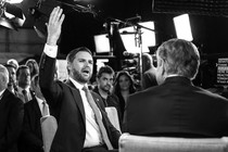 Black-and-white photograph of J. D. Vance in a newsroom set