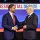 J. D. Vance and Tim Walz shake hands at the debate