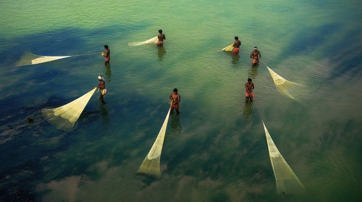 People fishing using nets