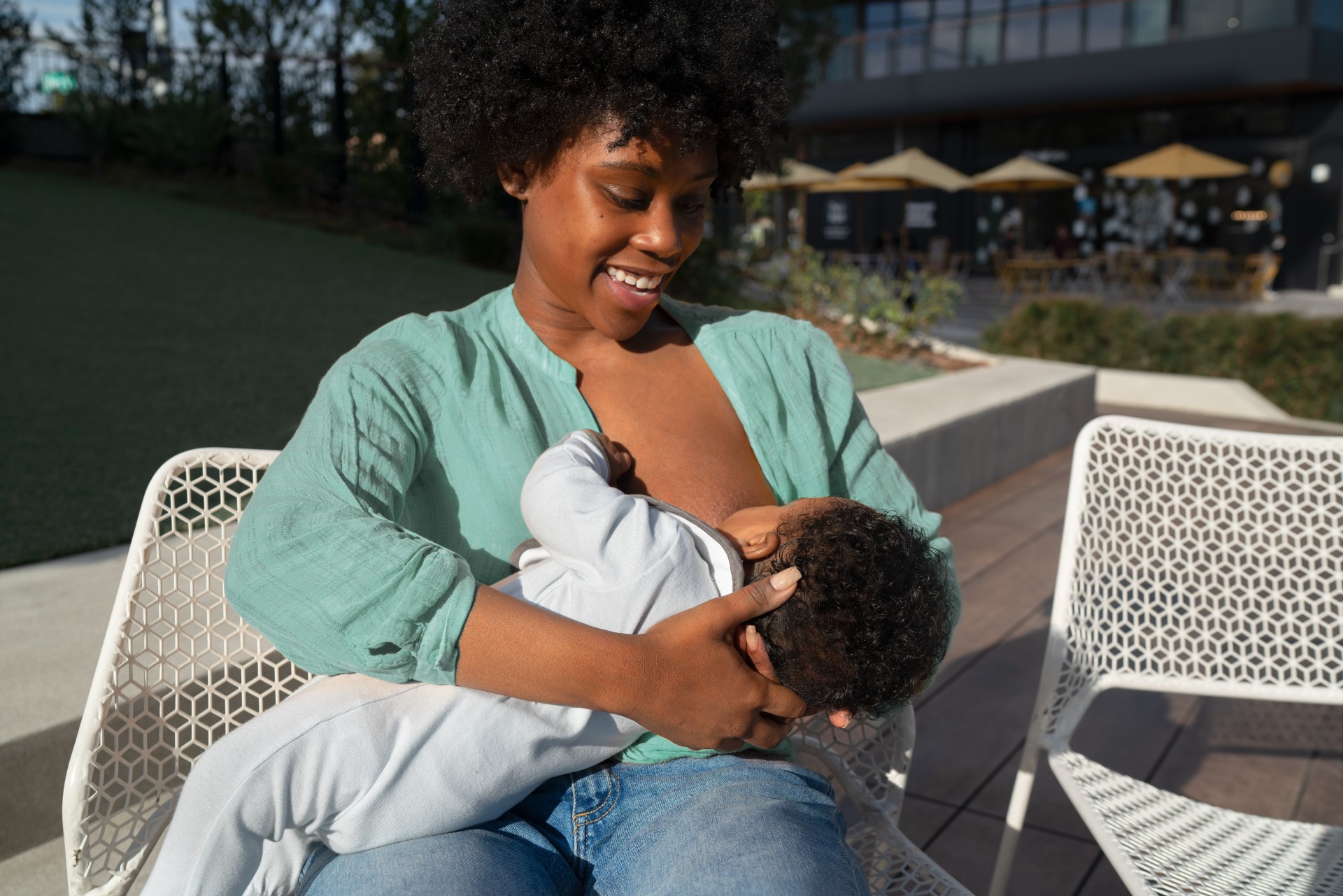 Happy mother breastfeeding a baby