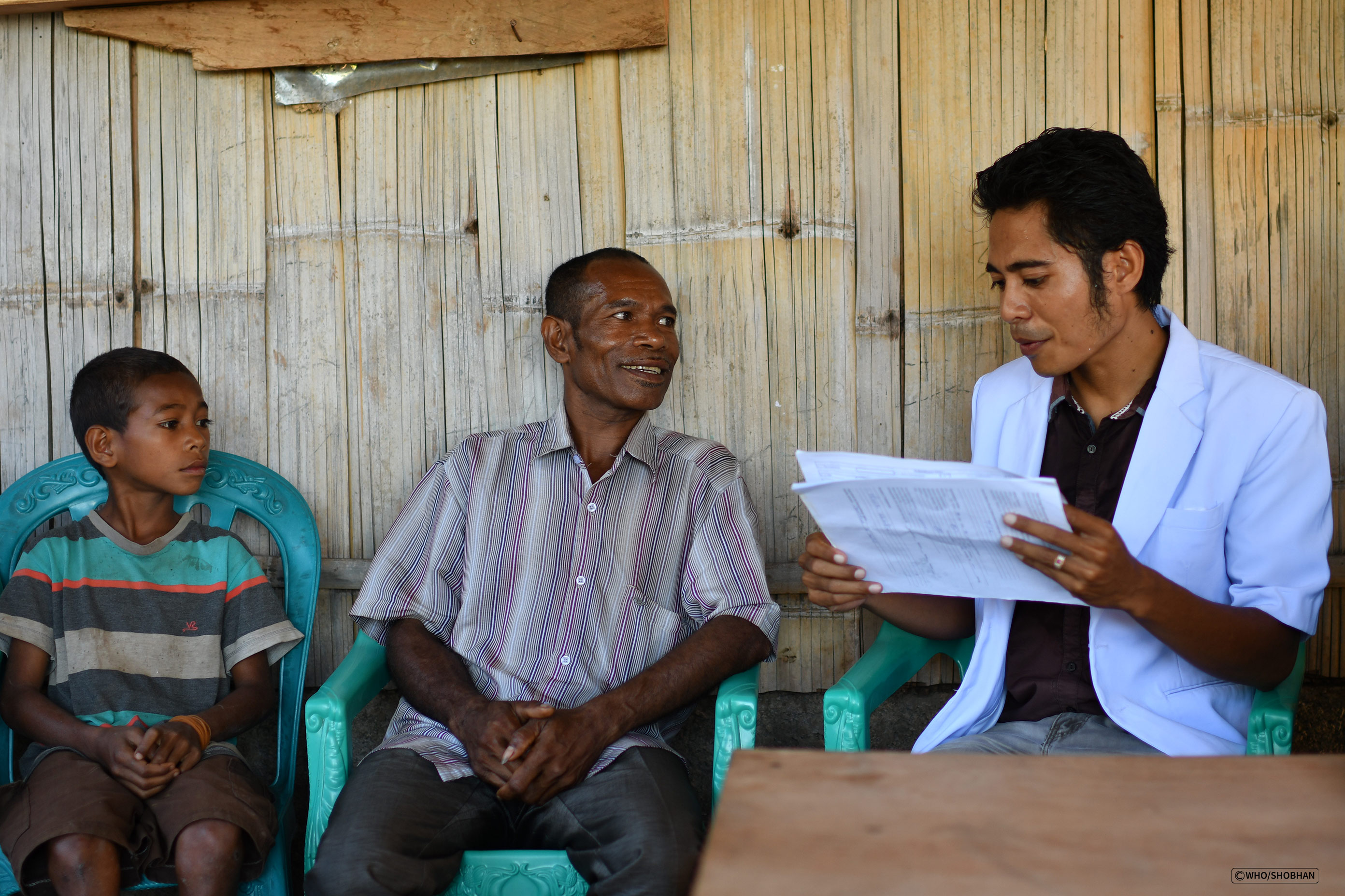 A family being visited by health care providers during the second round of implementation of Saude na Familia – the flagship primary health care programme.