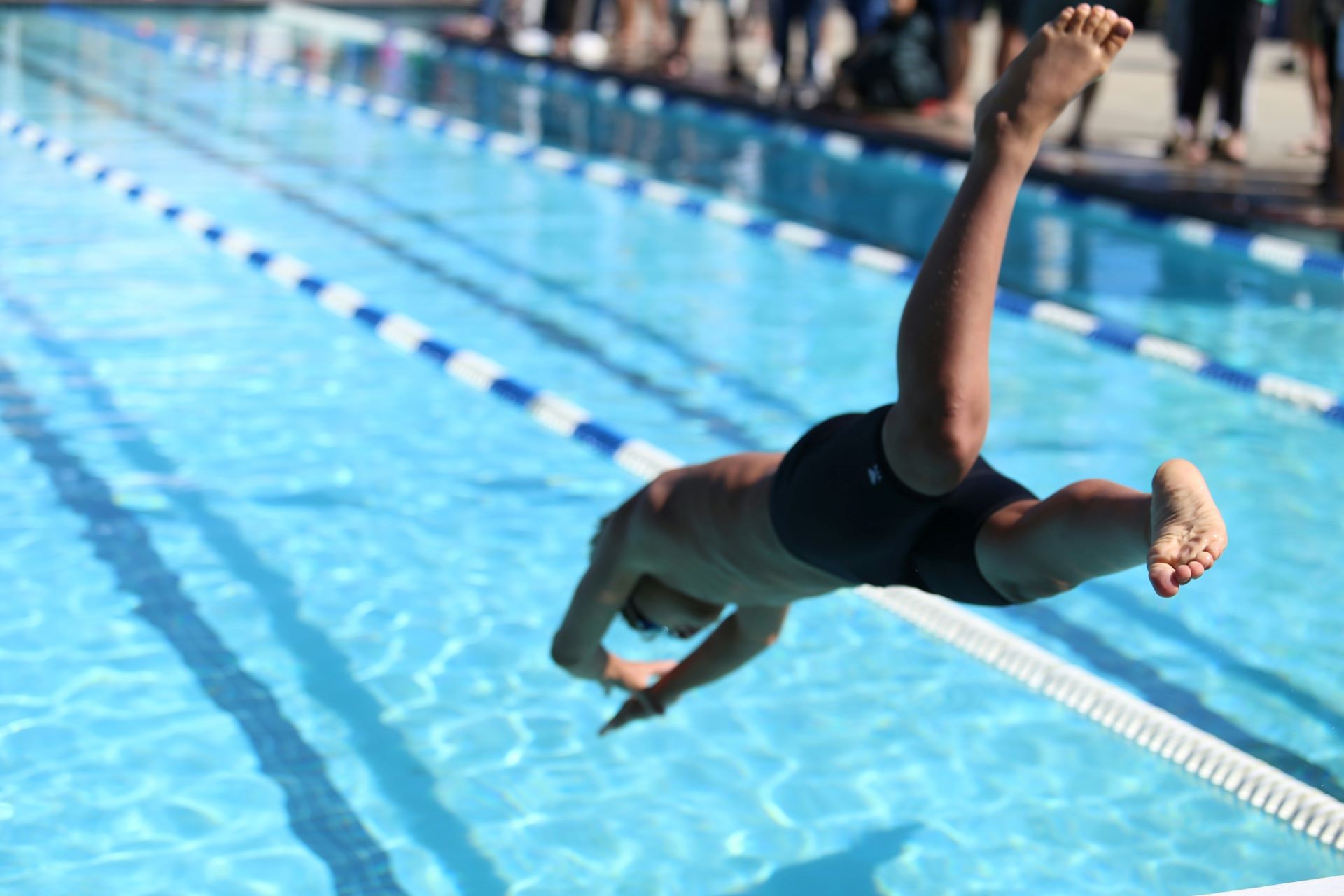 Man diving into a swimming pool