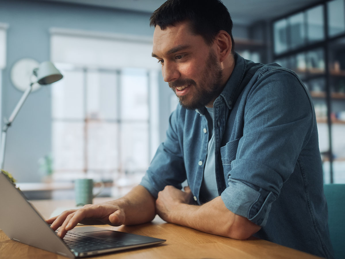 man looking into laptop