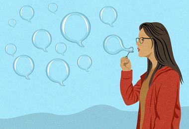 A woman blowing bubbles in the shape of speech bubbles