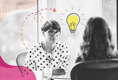 A black and white photograph of two women in conversation. The woman facing the camera is listening, with a laptop open in front of her. Around the photograph are some colourful shapes and an illustration of a lightbulb.