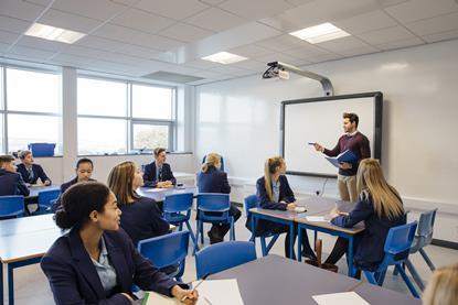 Students in a class active listening to a teacher