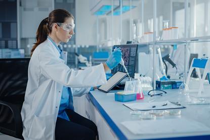 Woman in a lab conducting an investigation