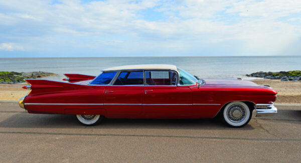 classic car parked on seafront promenade