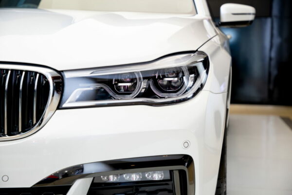 close up headlight front view of BMW 730 Ld M Sport luxury car