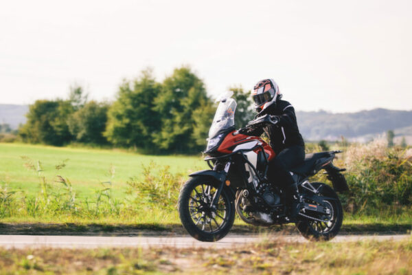 Drive a motorbike. Fast motorcycle in motion on asphalt road.