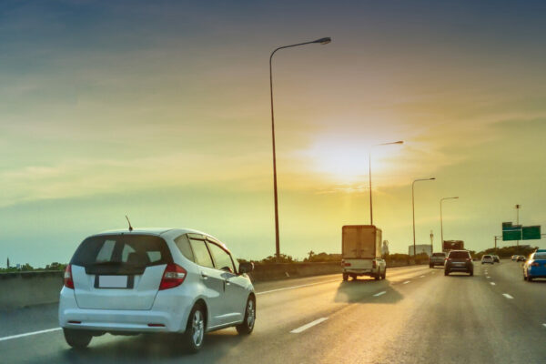 car on road and sunset background