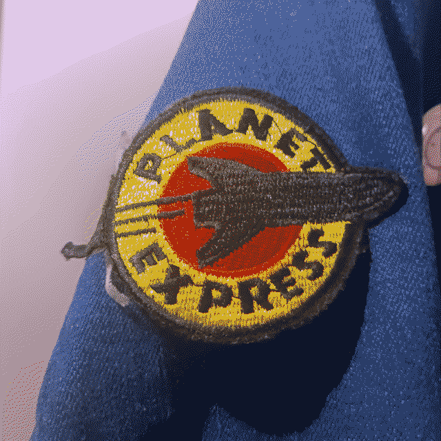 Pin badge. The Planet Express logo from Futurama