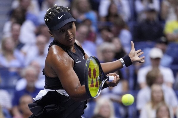 Naomi Osaka, of Japan, returns a shot to Karolina Muchova, of the Czech Republic, during a second round match of the U.S. Open tennis championships, Thursday, Aug. 29, 2024, in New York. (AP Photo/Matt Rourke)