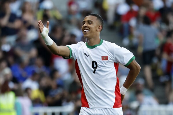 Morocco's Soufiane Rahimi celebrates after scoring his side's fourth goal during the men's bronze medal soccer match at the 2024 Summer Olympics, Thursday, Aug. 8, 2024, in Nantes, France. (AP Photo/Jeremias Gonzalez)