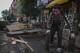 Workers demolish an outdoor dining shed outside Bricolage restaurant, Wednesday, July 31, 2024, in the Brooklyn borough of New York. (AP Photo/John Minchillo)