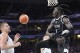 South Sudan's Wenyen Gabriel, right, celebrates after dunking as Serbia's Nikola Jokic watches during a men's basketball game at the 2024 Summer Olympics, Saturday, Aug. 3, 2024, in Villeneuve-d'Ascq, France. (AP Photo/Michael Conroy)