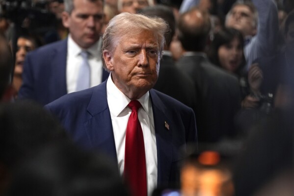 Republican presidential nominee former President Donald Trump speaks to reporters in the spin room after a presidential debate with Democratic presidential nominee Vice President Kamala Harris, Tuesday, Sept. 10, 2024, in Philadelphia. (AP Photo/Matt Slocum)