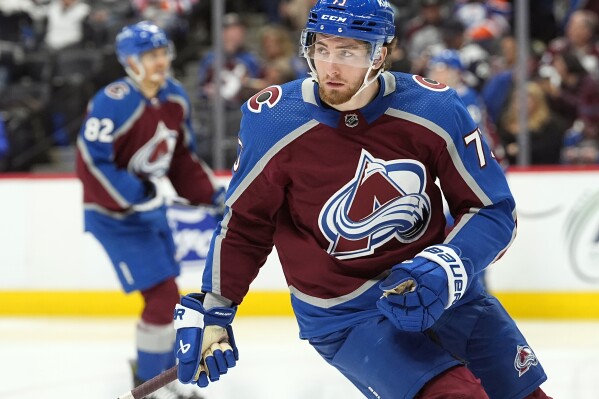 FILE - Colorado Avalanche center Yakov Trenin (73) skates in the second period of an NHL hockey game against the Edmonton Oilers, April 18, 2024, in Denver. The Minnesota Wild signed former Nashville and Colorado center Trenin to a four-year, $14 million contract. The team entered free agency with by far the most amount of dead buyout money in the NHL this summer at more than $14.7 million against their salary cap. (AP Photo/David Zalubowski, File)