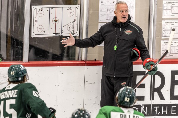 FILE - Minnesota Wild head coach Dean Evason speaks to players during NHL hockey training camp Sept. 22, 2022, in St. Paul, Minn. The Columbus Blue Jackets announced Monday, July 22, 2024, that they've hired Dean Evason as their new coach. (Carlos Gonzalez/Star Tribune via AP, File)