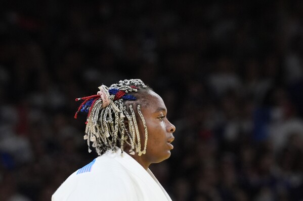 France's Romane Dicko reacts after the women's +78 kg semifinal match against Brazil's Beatriz Souza in the team judo competition, at Champ-de-Mars Arena, during the 2024 Summer Olympics, Friday, Aug. 2, 2024, in Paris, France. (AP Photo/Eugene Hoshiko)